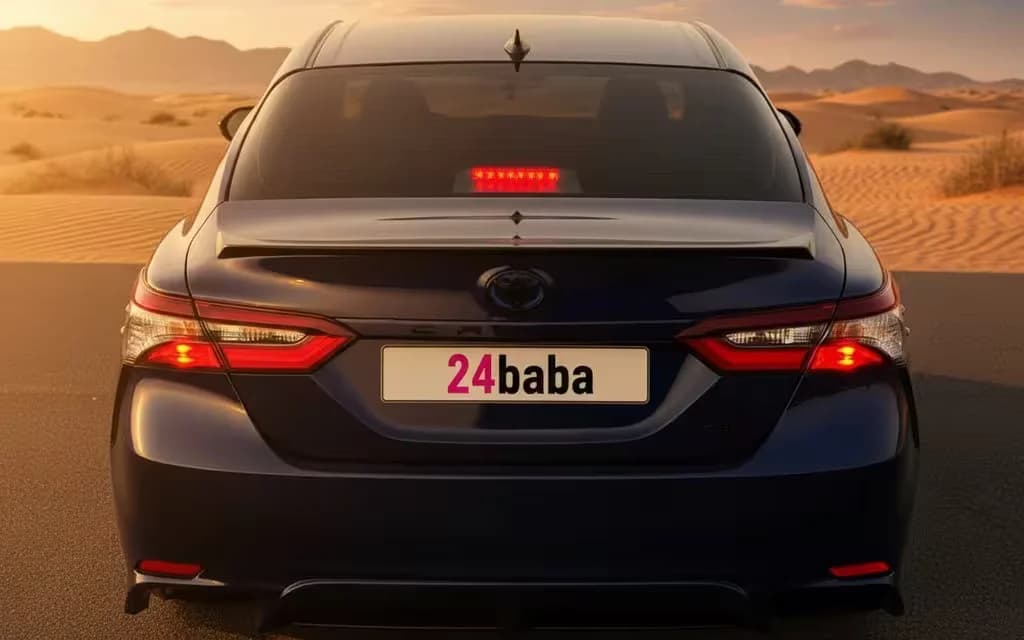 Toyota Camry 2023 Blue rear view showing taillights – rental in Dubai