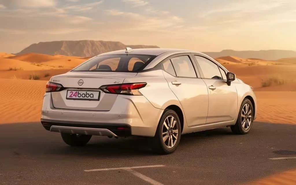Nissan Versa 2024 Silver rear view showing taillights – rental in Dubai