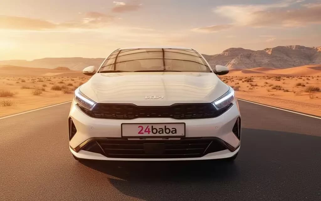 Kia K3 2024 White front view with headlights – rental in Dubai
