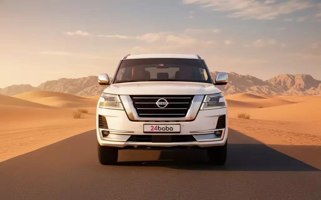 Nissan Patrol 2022 White front view with headlights – rental in Dubai