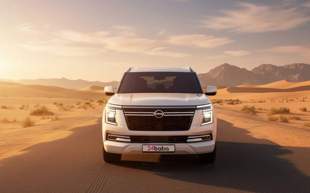 Nissan Patrol 2025 White front view with headlights – rental in Dubai