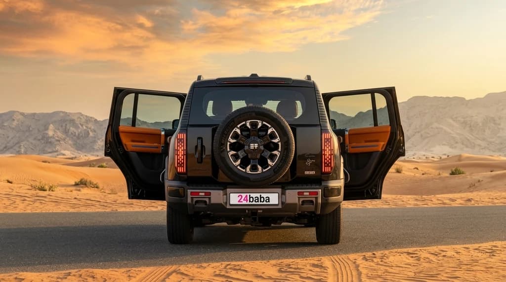 Jetour G700 2026 Black rear view with tailgate spare wheel and rear doors open – rental in Dubai