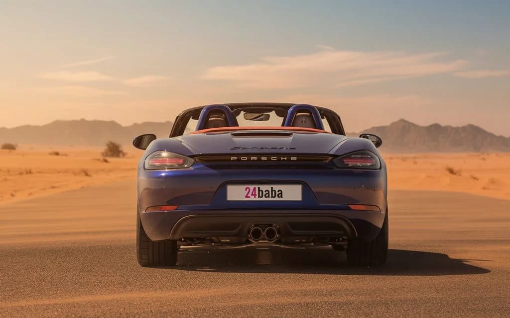 Porsche Boxster 2024 Black rear view showing taillights